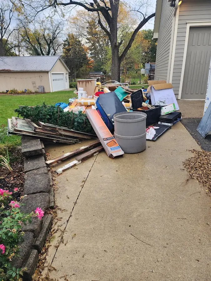 Dumpster being loaded with debris for 30 Yard Dumpster Rental in Honey Brook